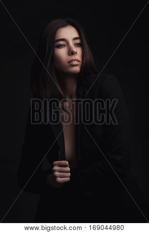 portrait young elegant woman wearind black jacket. Fashion studio shot.