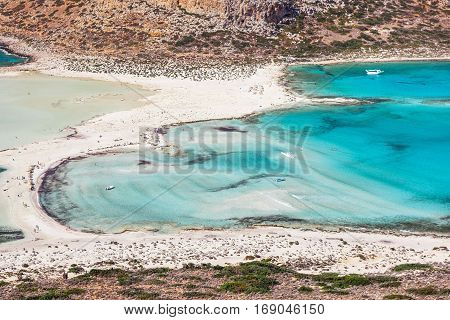 Wonderful sea lagoon with clear turquoise water on a bright sunny day looks like a paradise. Balos bay on Crete island Greece.