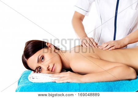 Woman having massage of body in the spa salon. Beauty treatment concept.