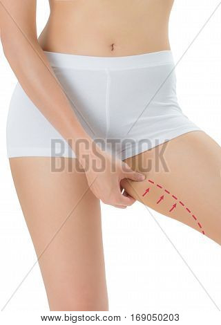 Woman grabbing skin on her Inner thigh with the drawing red arrows Lose weight and liposuction cellulite removal concept Isolated on white background.