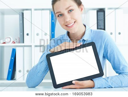 young woman showing a dgital tablet display - Portrait of a funny girl holding a tablet PC
