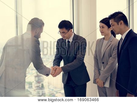 Business Partners Introductionary Handshake Bow