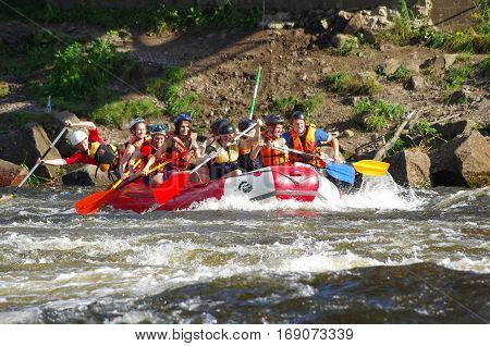 LOSEVO - AUGUST 18: Whitewater rafting on AUGUST 18 2012 RUSSIA. Unidentified persons enjoy whitewater rafting on the Vuoksi river in Losevo Leningrad region Russia