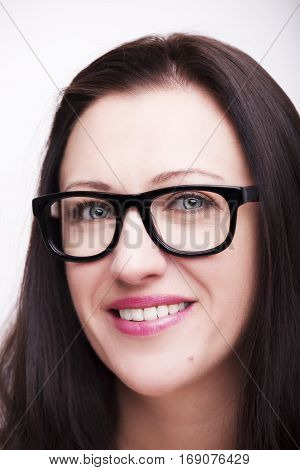 Beautiful young woman wearing glasses close-up isolated on white background.