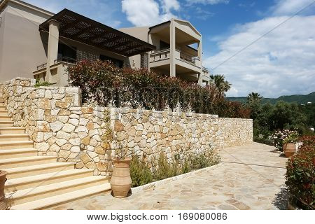Sivota Greece - May 09 2013: Modern stylish building of villa with a terrace and blue sky in Greece.