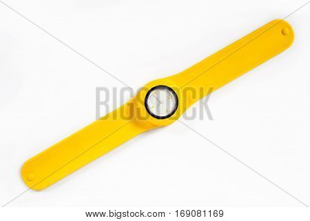 Yellow watch on a flexible yellow thong is isolated on a white background