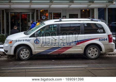 Toronto, Canada - December 21, 2016: Dodge Grand Caravan CRU 2204 from the Toronto Police in operation in Downtown