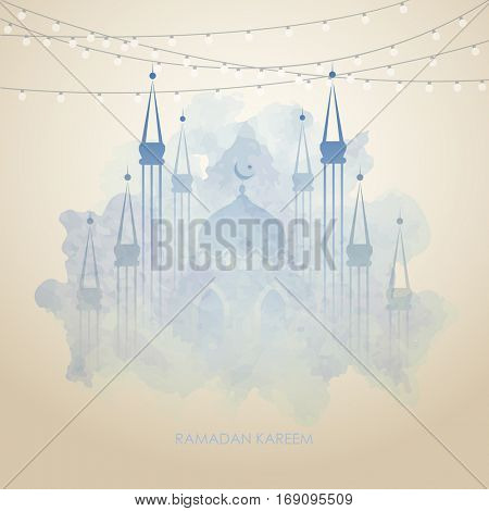 Beautiful mosque, made by colors splash for Islamic holy month of prayers, Ramadan Kareem celebrations. Ramadan greetings background. View of mosque in blue grunge night background with shiny lights.