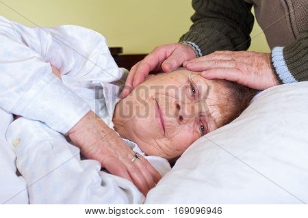Picture of a bedridden elderly woman at home
