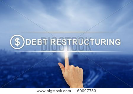 hand pushing Debt restructuring button on a virtual screen interface