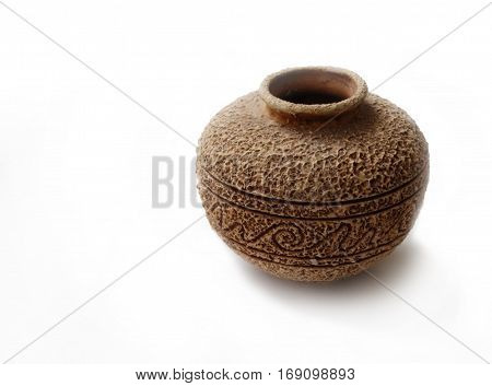 old handmade ceramic vase with rough suface and ornament