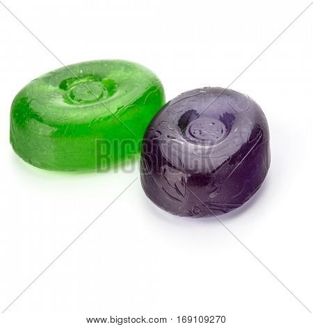 Two colorful fruit hard sugar candies,  boiled sweeties or sugar plums isolated on white background cutout