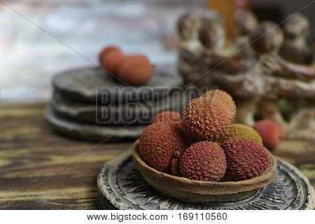 Tropical fruit - Lychees on wooden background