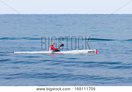 Athlete Training On Kayak Winter Morning On Sea Near Coast