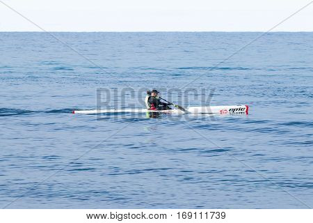 Athlete Training On Kayak Winter Morning On Sea Near Coast