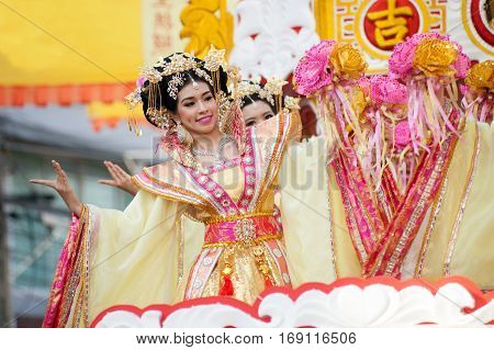 NAKHONSAWAN,THAILAND - JANUARY 1,2017 : Group of Unidentified pretty woman is Fairy performing and dance during the Chinese New Year Parade into city in Nakhonsawan Province,Middle of Thailand.
