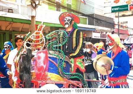 NAKHONSAWAN ,THAILAND - JANUARY 31,2017 : Unidentified fighting show of villager warriors ( Aung-Gor ) on the street in city during the Chinese New Year celebrations in Nakhonsawan Province,Middle of Thailand.