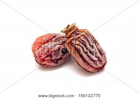 Several dried persimmon isolated on white background