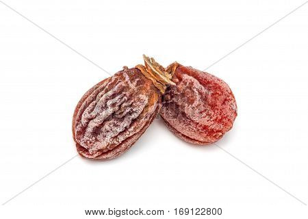 Several dried persimmon isolated on white background