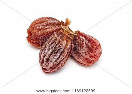 Several dried persimmon isolated on white background