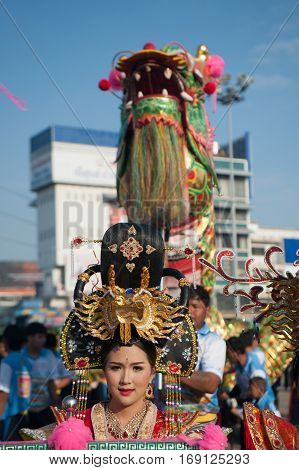NAKHONSAWAN , THAILAND - JANUARY 31,2017 : Group Parade of Golden dragon show at Middle market in Nakhonsawan city during the Chinese New Year celebrations in Nakhonsawan Province ,Middle of Thailand.