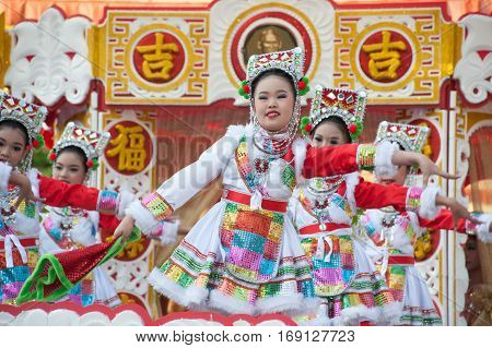 NAKORNSAWAN ,THAILAND - JANUARY 31,2017 : Unidentified young girls provide music for dance on the parade during Chinese New Year celebrations in Nakornsawan Province ,Middle of Thailand.