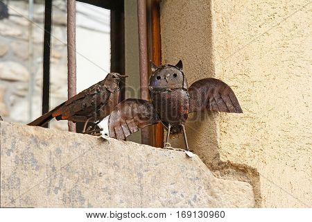 Besalu Spain - September 09 2014: Decorative birds made of metal for sale on the old street in Besalu Spain