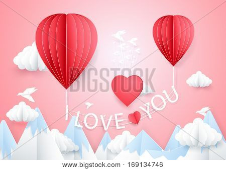 Love concept. Hot air balloons flying with i love you words on mountain. Paper craft style