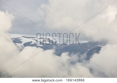 Norwegian fjord cloudy landscape with glacier. Norway adventure tourism