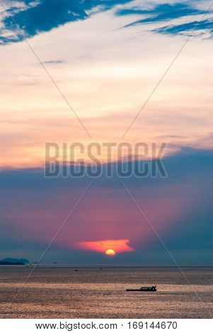 Beautiful aerial view of sea at sunrise and twilight time with the shade of shadow boat in motion blur Pataya Thailand.
