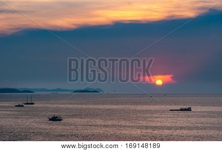 Beautiful aerial view of sea at sunrise and twilight time with the shade of shadow boat in motion blur Pataya Thailand.