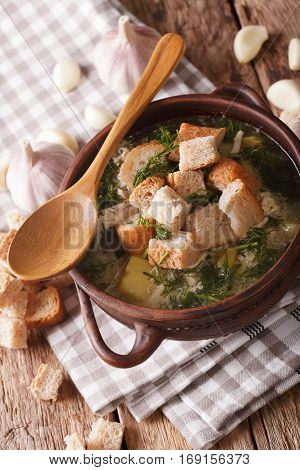 Garlic Soup With Croutons Close-up In A Bowl. Vertical