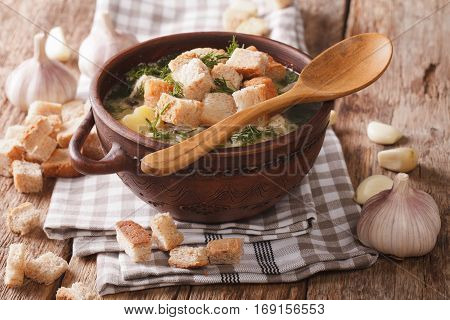 Homemade Garlic Soup With Croutons Close-up In A Bowl. Horizontal