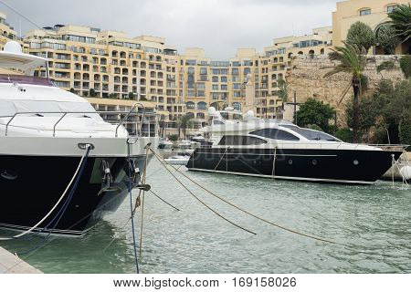 Super yachts moored at Portomaso Marina in St. Julian Malta