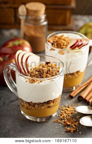 Layered yogurt and applesauce parfait with granola