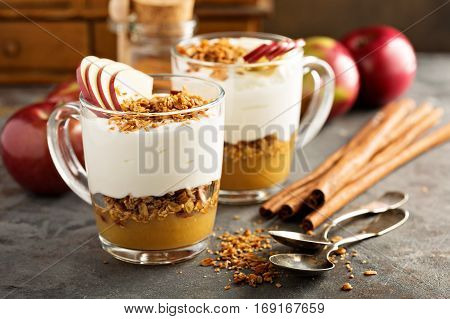 Layered yogurt and applesauce parfait with granola