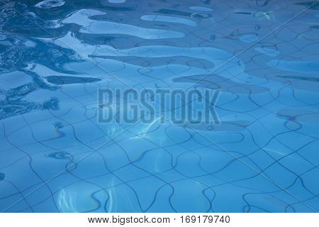 Swimming Pool water textured surface background relfection