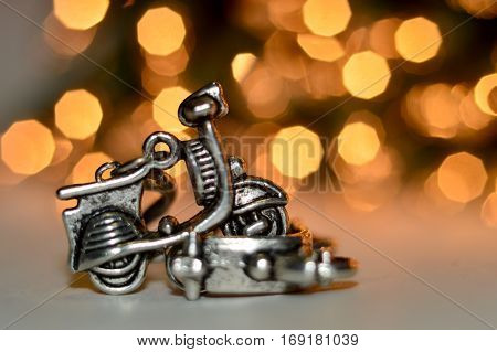 Earrings made by hand in the form of scooters.