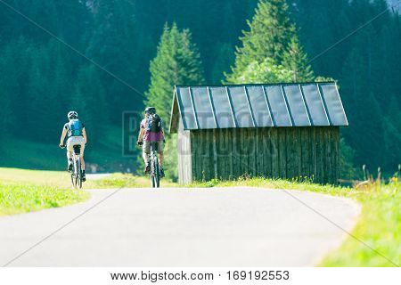 Cycling senior couple enjoying summer at the vilsalpsee in austria