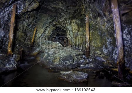 Collapsed and forgotten tunnel of an abandoned coal mine