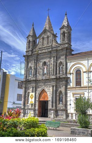 Old colonial church facade, on a sunny morning, blue sky, in Ibarra Ecuador.