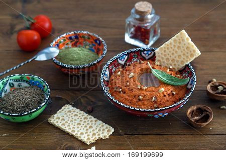 Walnuts And Pepper Dip Sauce Muhammara And Ingredients Close-up On The Table. Horizontal