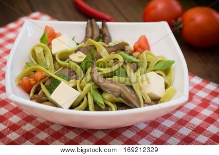 Plate Of Spaghetti Dough With Spinach And Oyster Mushrooms. Italian Cuisine, Italian Recipes. Wooden