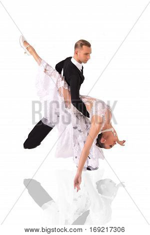 beautiful ballroom dance couple in a dance pose isolated on white background. sensual professional dancers dancing walz tango slowfox and quickstep