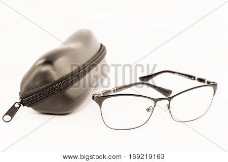 Black eye glasses and case isolated on white background