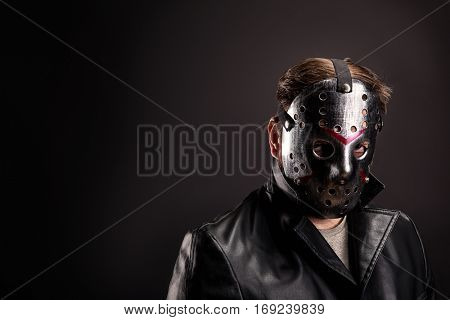 Bloody murderer in hockey mask portrait
