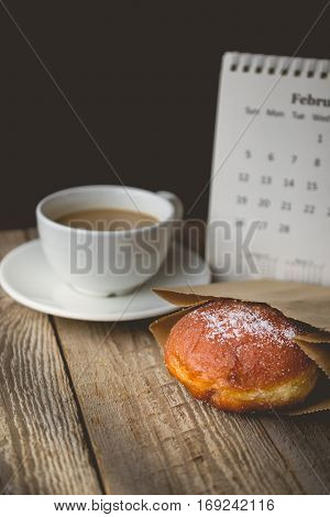 Relax time with Hot Coffee and Donut on wood Background used for food ad or website promote. Snacks for people to work in the rush hour