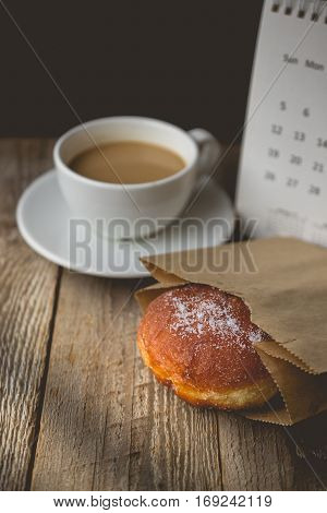 Relax time with Hot Coffee and Donut on wood Background used for food ad or website promote. Snacks for people to work in the rush hour