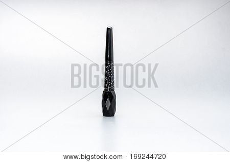 Eyeliner bottle beauty makeup cosmetic on studio