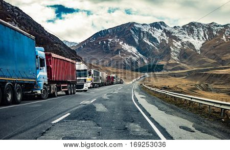 military road in Georgia with truks queue
